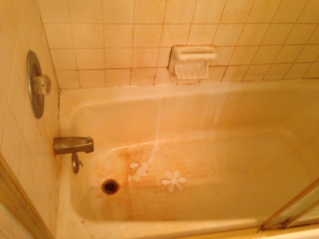 Before Picture of Dirty and Iron Stained Bathtub