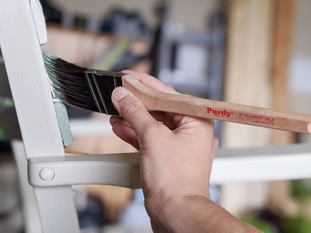 Painting color block design on outdoor chairs using a Purdy Clearcut Dale Brush