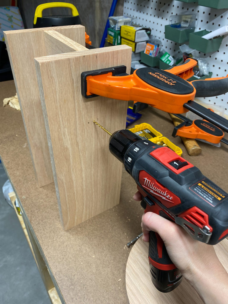Assembling modern wood stool using clamps and a drill
