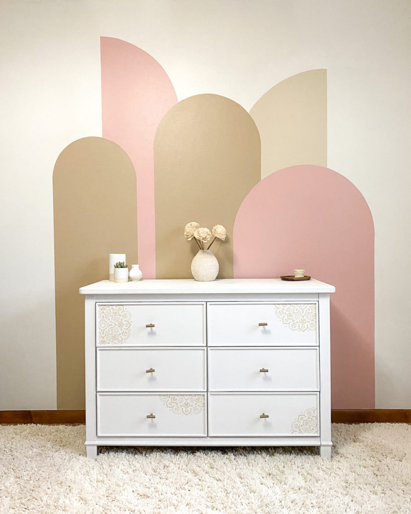 Finished color block arches wall in little girl's pink bedroom
