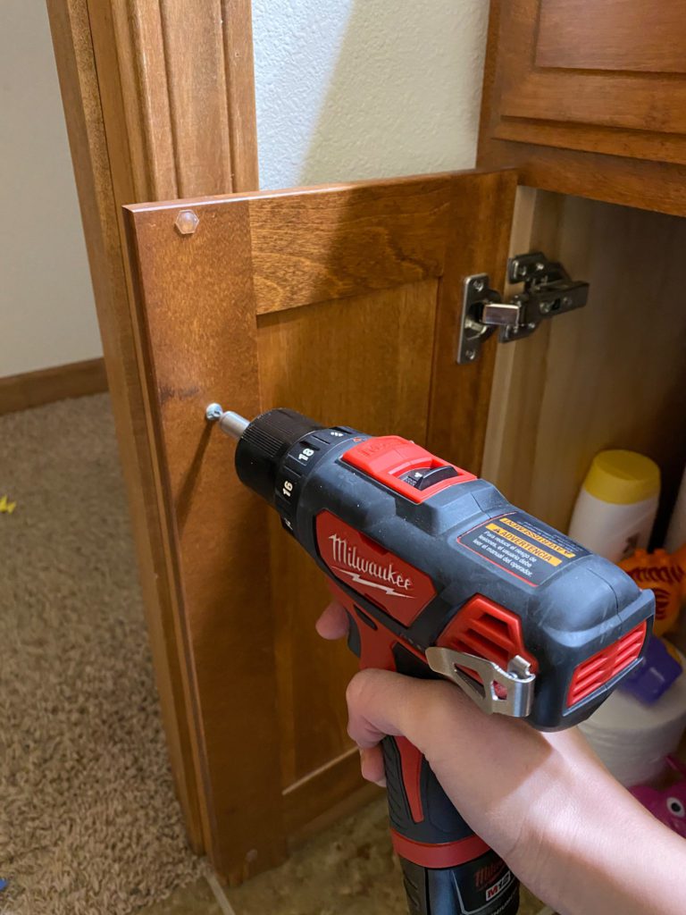 Removing hardware from bathroom vanity before painting