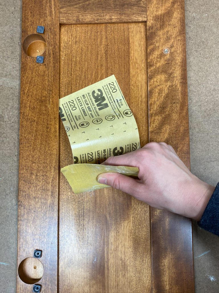 Sanding bathroom vanity doors before painting them