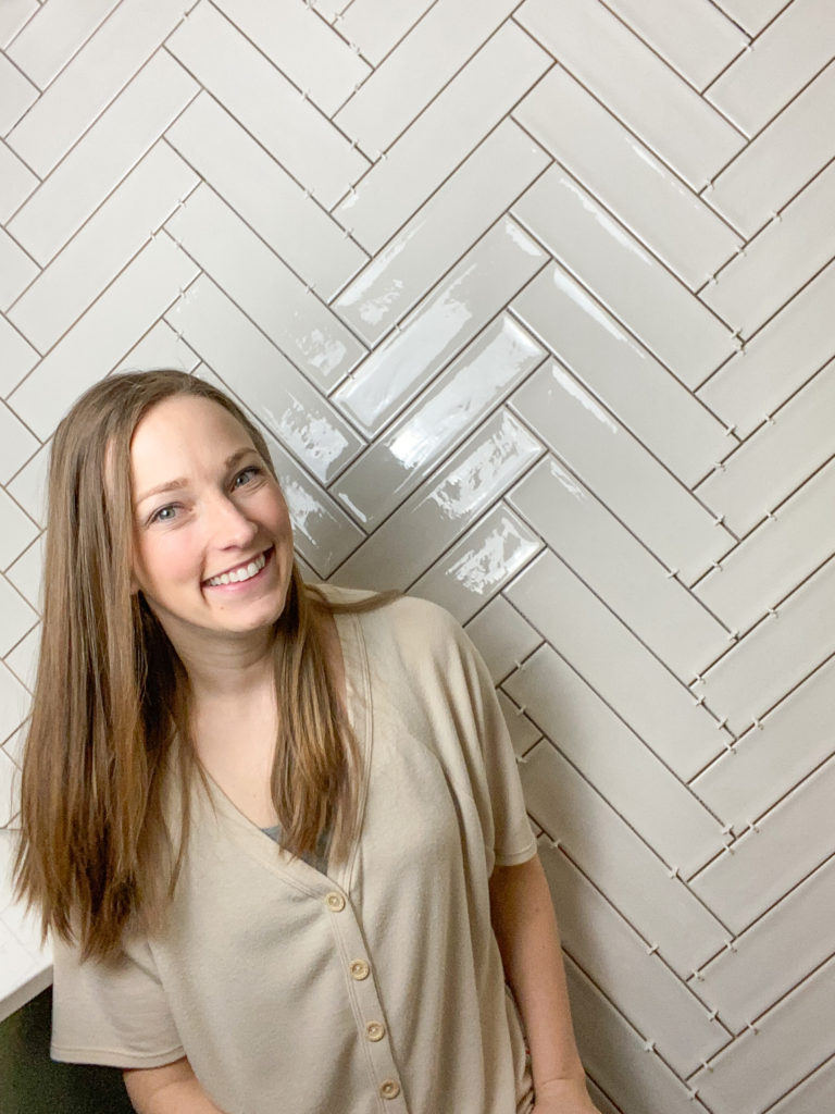 Herringbone pattern wall of tile in bathroom