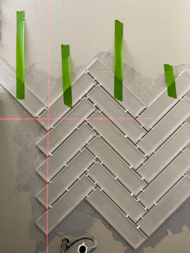 Using a laser level to get a perfect herringbone pattern with tile