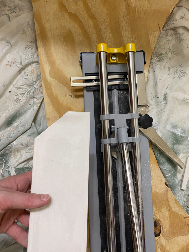 Cutting tiles with tile cutter