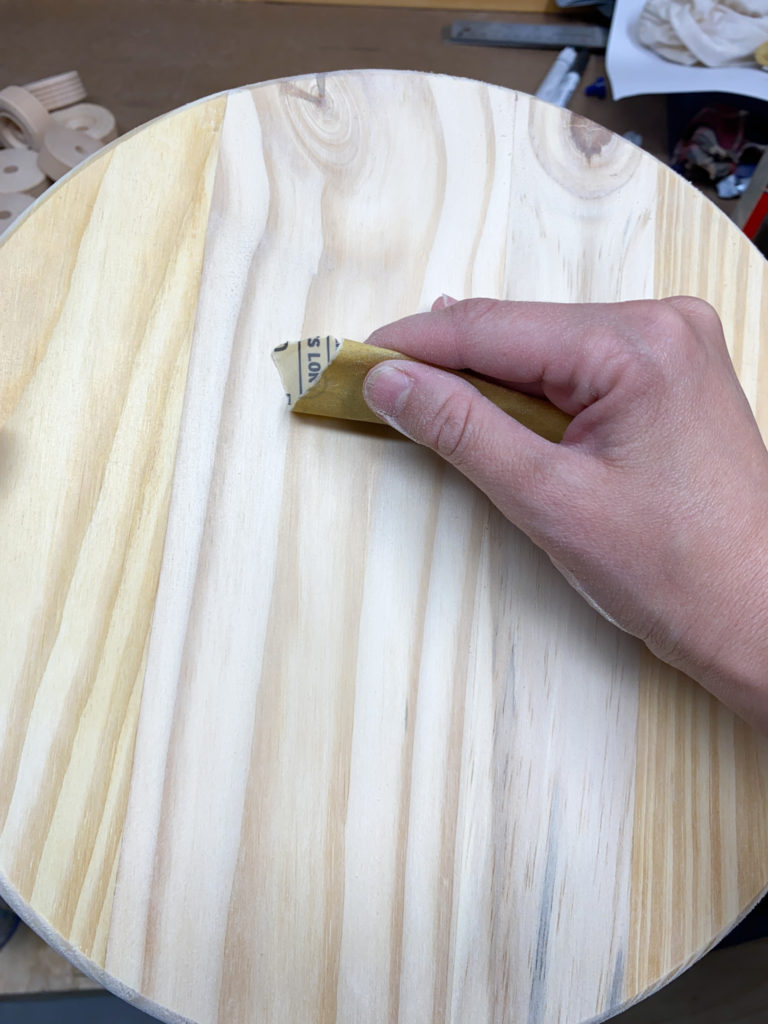 Sanding wood rounds for plant risers