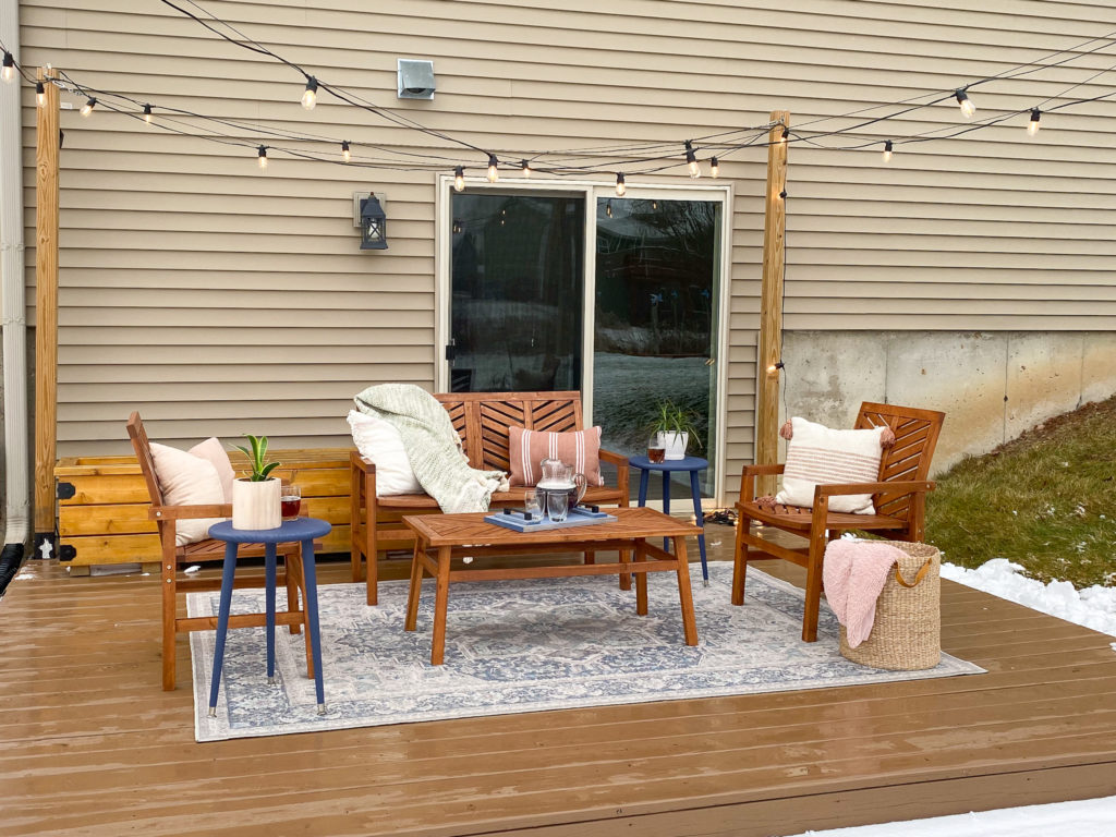 Outdoor Patio with Blue Rug, Patio Lights, and Herringbone Furniture